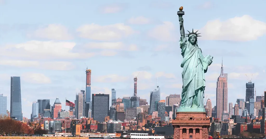 The Statue of Liberty over the Scene of New york cityscape river side